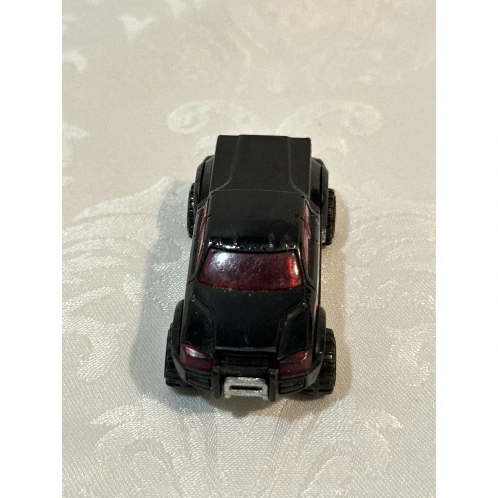 Hot Wheels Mega Duty black pickup truck, specifically the 2010 Heat Fleet